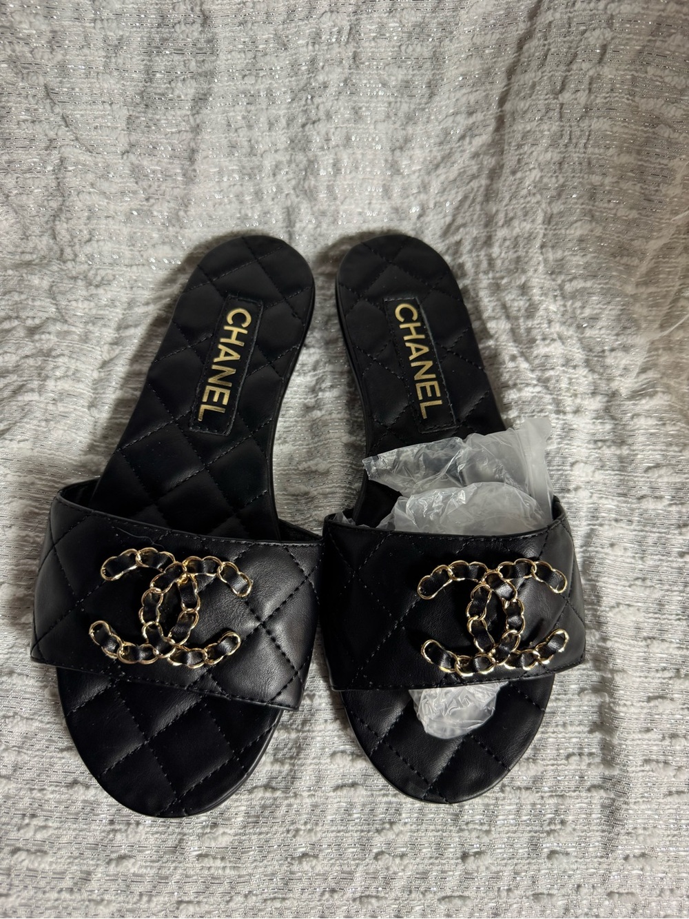 CHANEL Black Quilted Leather Slide Mules with Gold Chain CC Emblem